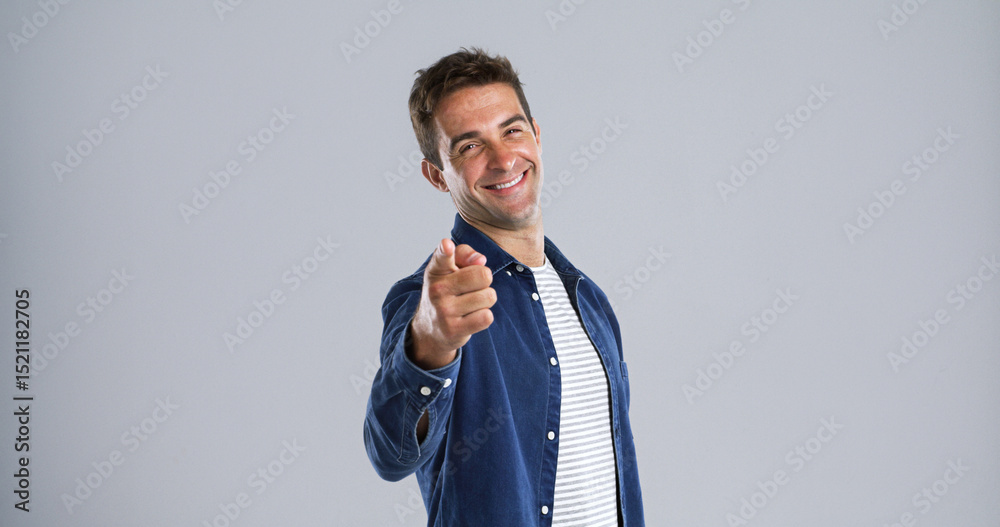 Poster portrait, pointing to you and man in studio, smile and choice with confidence on white background. f