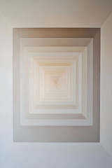 Fototapeta premium A series of concentric squares in soft gradient shades, creating a sense of movement inward toward the center of the canvas