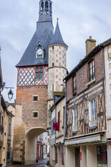 Obraz premium Saint Fargeau clock tower dominating Place Republique in Bourgogne Franche Comte, France