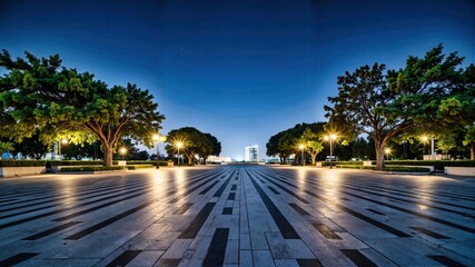 Nighttime Urban Plaza with Illuminated Trees and Reflective Pavement