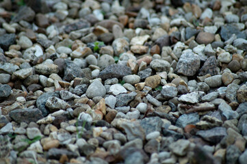 Gravel texture or gravel background for design. Real grunge texture on the beach.Top view of ground gravel.