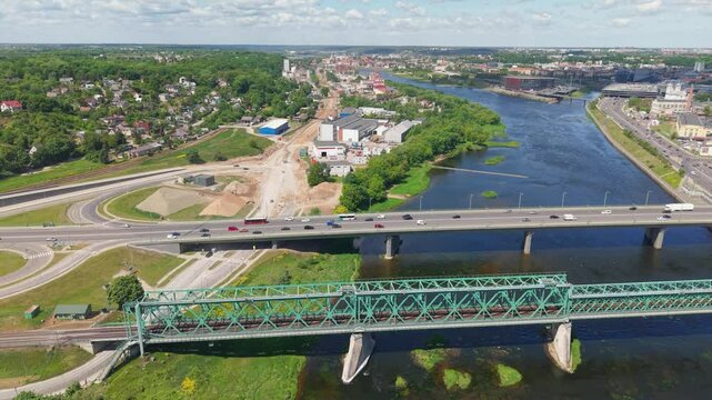 Drone view of the Neris River and bridges near Kaunorama apartment buildings in Kaunas, Lithuania