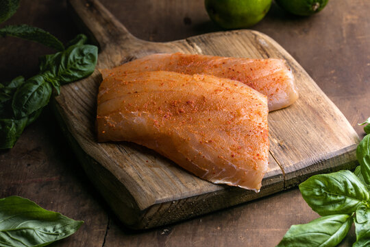 Red snapper fish fillet on wooden background