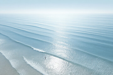 breathtaking aerial view of ocean surface stunning reflections of sunlight on water