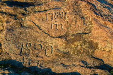 Inscriptions on the stone - 1789 and 1820. Rock granite register in Kremenchuk city, Ukraine. Dates...