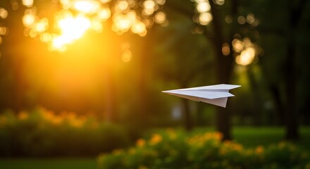 Paper Plane Gliding Gently in Outdoor Setting With Trees, Sunbeams, and Late Afternoon Breeze