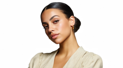 Studio portrait of a young woman with olive skin and dark hair, wearing a stylish neutral outfit and earrings, exuding confidence against a transparent background