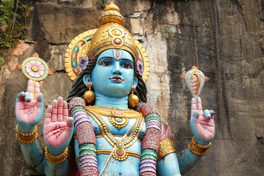 Four-armed statue of Hindu god Vishnu, detailed portrait, divine deity, Indian sculpture, Vaishnavism, religious art, ancient mythology