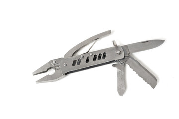 Stainless steel multipurpose tool showing pliers, knife and saw, isolated on white background