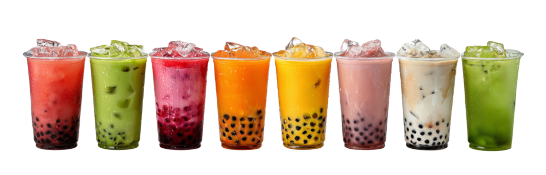 Variety of fruit-flavored bubble teas with ice cubes and tapioca pearls arranged in a row.