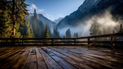 Fototapeta premium light brown wooden deck with mountain valley blurred behind, early morning fog