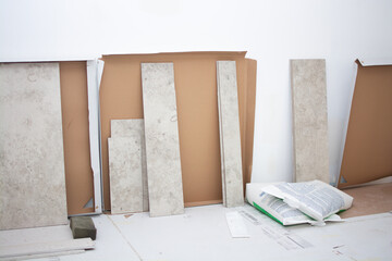 Ceramic tile cuts after laying. Construction process.