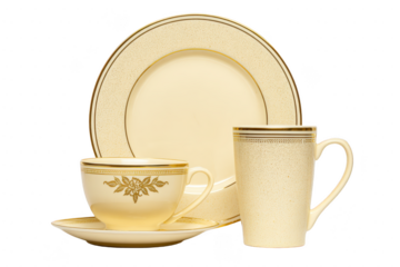 Elegant cream colored ceramic dinnerware set with gold accents, including plate, teacup, saucer, and mug, perfect for formal dining