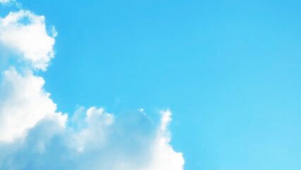 Blue pastel sky with white fluffy cloud. Cumulus clouds background. Cloudscape morning sky. The concepts of freedom of life, never give up and positive though energy.