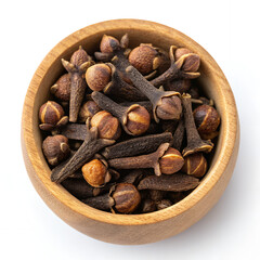 Aromatic Cloves in Wooden Bowl: A vibrant image displaying a close-up of aromatic cloves, nestled in a rustic wooden bowl, highlighting their rich texture and captivating earthy tones.