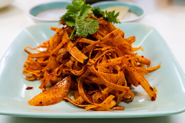 tofu seasoned with spicy sauce and cilantro