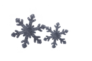 Two glittery silver snowflakes on transparent background, showcasing intricate designs and sparkling textures, perfect for winter themed decorations or festive crafts