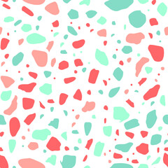 A playful abstract pattern featuring irregular shapes in soft coral and mint green on a white background.