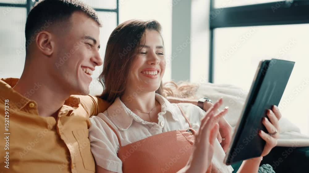 Poster Couple, laughing and scroll with tablet on sofa for social media meme, funny post or comedy video. People, bonding together and pointing to digital app in home for web browsing and streaming service