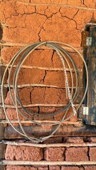 Cowboy lasso hanging on a wattle and daub wall