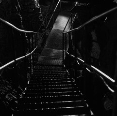 Descending into Shadow: A Stairway within Oylat Cave's Depths