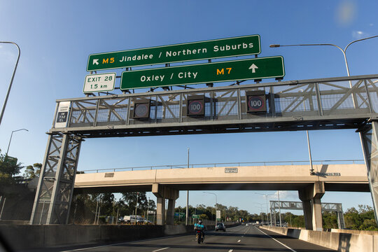 street signs over a major motorway in Brisbane