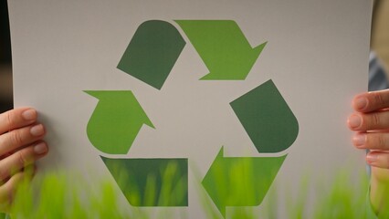 Recyclable symbol holding unrecognizable businesswoman girl woman in office eco-friendly business circle sorting paper protect ecology recycling saving nature reuse zero waste green energy bio recycle