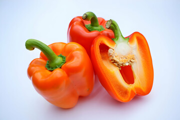 Three Orange Bell Peppers Isolated on White Background