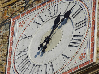 A large old clock located on the Stephen Tower in Baia Mare city, Romania