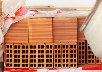 Pallet of hollow bricks ready for building construction