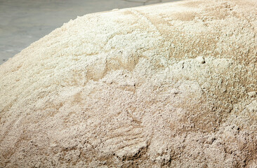 Pile of sand for cement mixing waiting to be used in construction