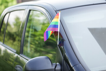 LGBT Pride Rainbow Flag on Car Side Mirror Outdoors