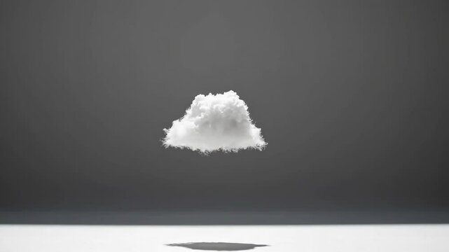 Minimalist video concept of a fluffy cloud hovering mid-air, captured from a side angle against a neutral gray background, casting a shadow below. Live desktop wallpaper.