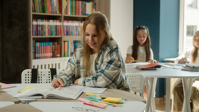 Caucasian girl teen student teenager daughter kid studying lesson in school classroom pupil schoolgirl happy funny child learning exam looking at camera thumb up like super recommend gesture education - Powered by Adobe