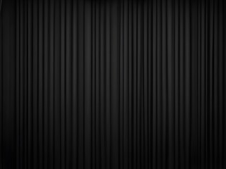 Pleated wavy black curtains hanging vertically with the lighting creates a sense of depth and shadow. Black texture background.