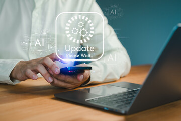 Man holding smartphone during system update with futuristic AI interface, surrounded by digital elements and laptop on desk. Technology concept of system upgrades and software maintenance.