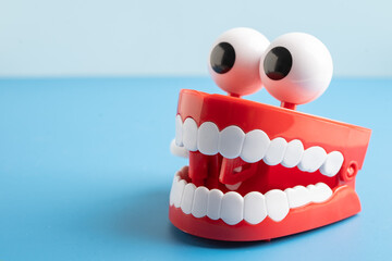 Tooth funny toy denture red color jaw and eye.