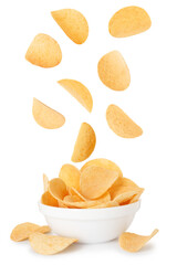 Tasty crispy potato chips falling into bowl on white background
