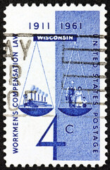 Postage stamp USA 1961 scales of justice, factory, worker and family, 50th anniversary of the 1st successful Workmen's Compensation Law