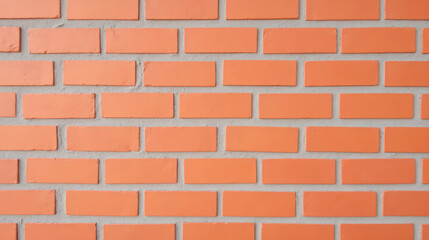 Obraz premium Bright orange brick wall with smooth texture, showcasing modern design. uniformity of bricks adds vibrant touch to any space