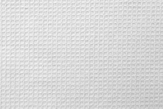 Texture of white fabric with pattern as background, top view