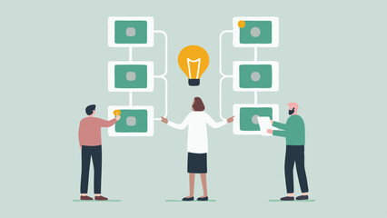 Three people collaborating around a diagram with an idea bulb in the center of the diagram shown