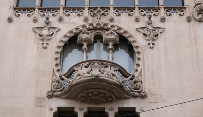 Obraz premium Art Nouveau building facade in Barcelona, Spain. Interesting Art Nouveau Architecture Buildings facade in Barcelona, Spain. (Arquitectura modernista). These fancy buildings date for the most from the 
