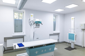 An innovative, multifunctional X-ray diagnostic system, providing high image quality and flexible X-ray examinations, stands in a sterile medical room.