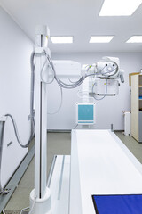 An innovative, multifunctional X-ray diagnostic system, providing high image quality and flexible X-ray examinations, stands in a sterile medical room.