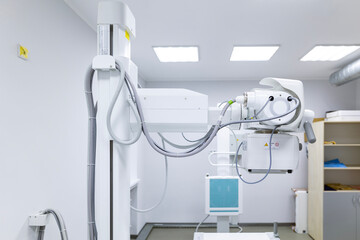 An innovative, multifunctional X-ray diagnostic system, providing high image quality and flexible X-ray examinations, stands in a sterile medical room.