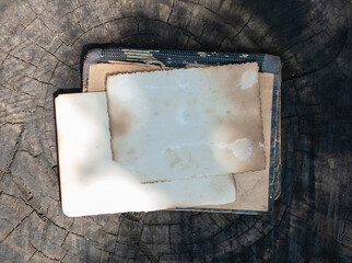 Two vintage empty papers lies on the old wooden background