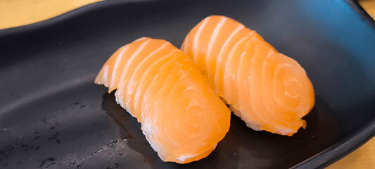 Sushi on a black plate. Japanese food. Healthy food.