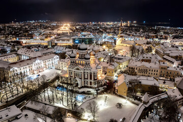 Aerial night View of Tallinn in winter with Alexander Nevsky Cathedral, roofs with snow, Christmas mood