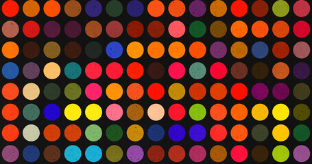 Colorful dot pattern on black background, with evenly spaced circles in vibrant shades creating a bold and modern abstract design